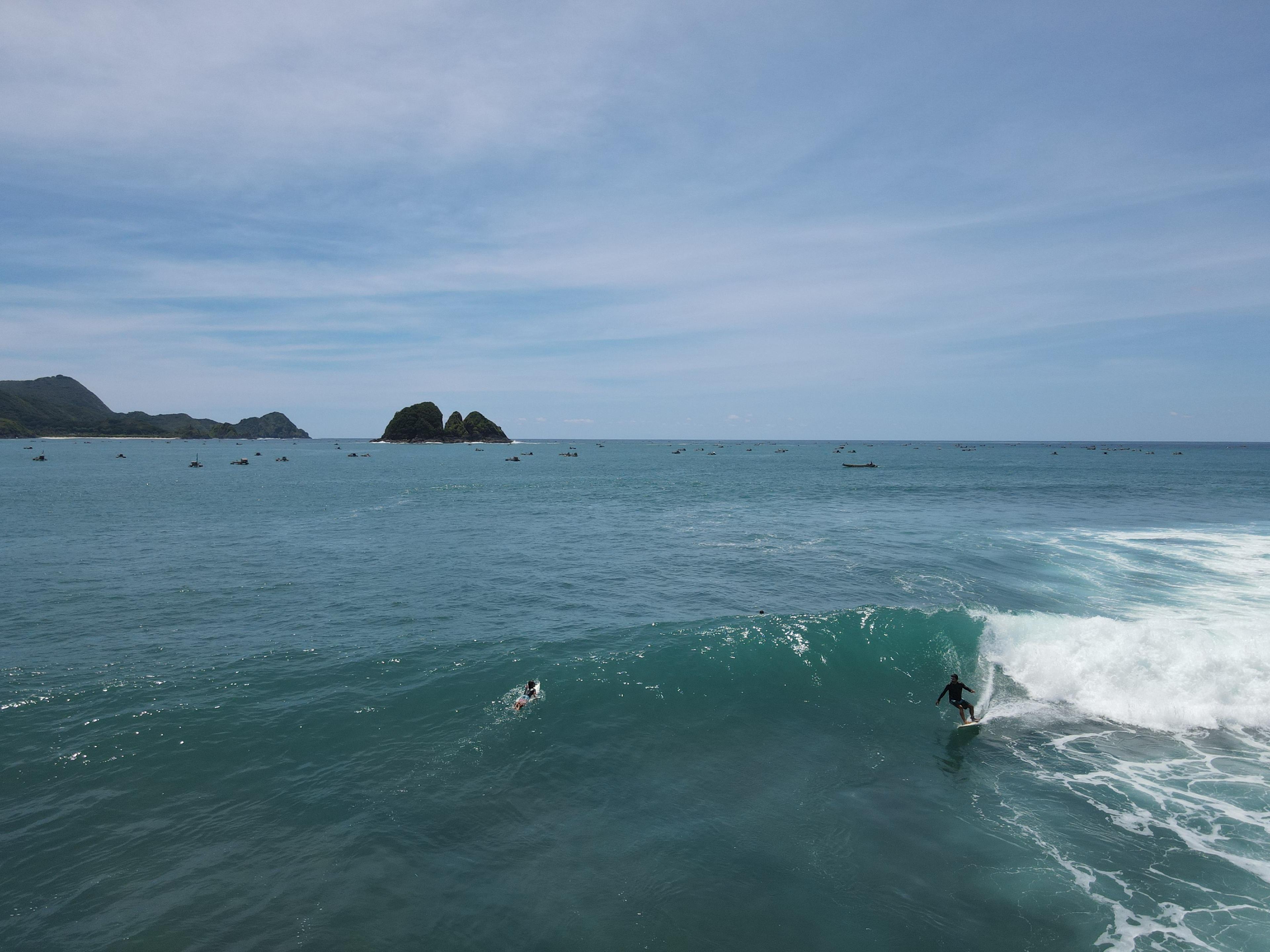 A clean right-hand reef wave at Serangan Beach near Selong Belanak