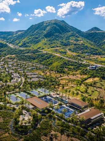 Inland aerial rendering of tennis and padel courts at the Samara Lombok sports pavilion