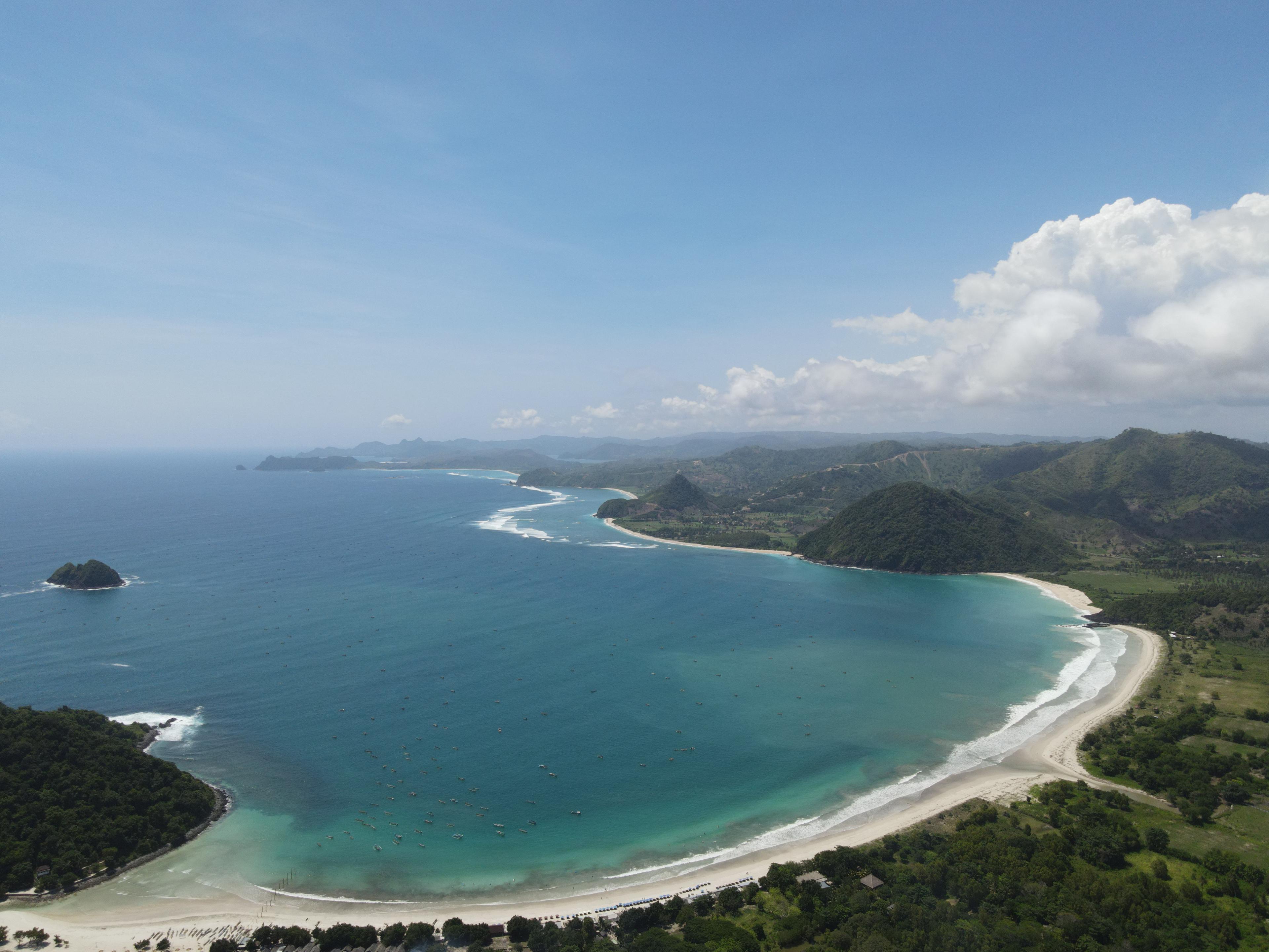 Wide white sand and turquoise water at Selong Belanak Beach in South Lombok