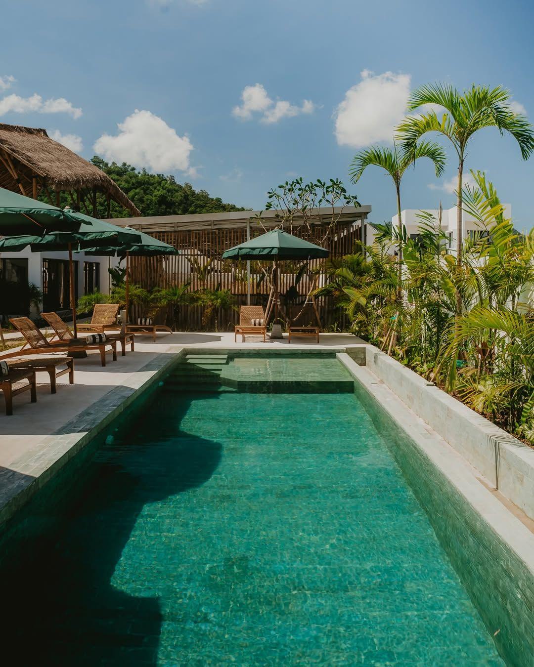 Swimming pool and tropical garden at Kairos Boutique Sports Hotel
