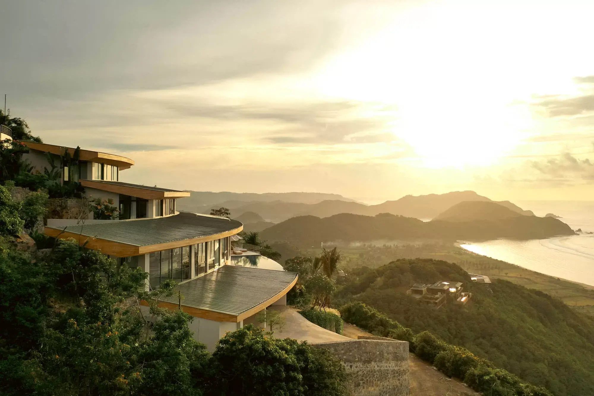 Tampah Hills villa estate at sunset, overlooking Tampah Beach and the south Lombok coast