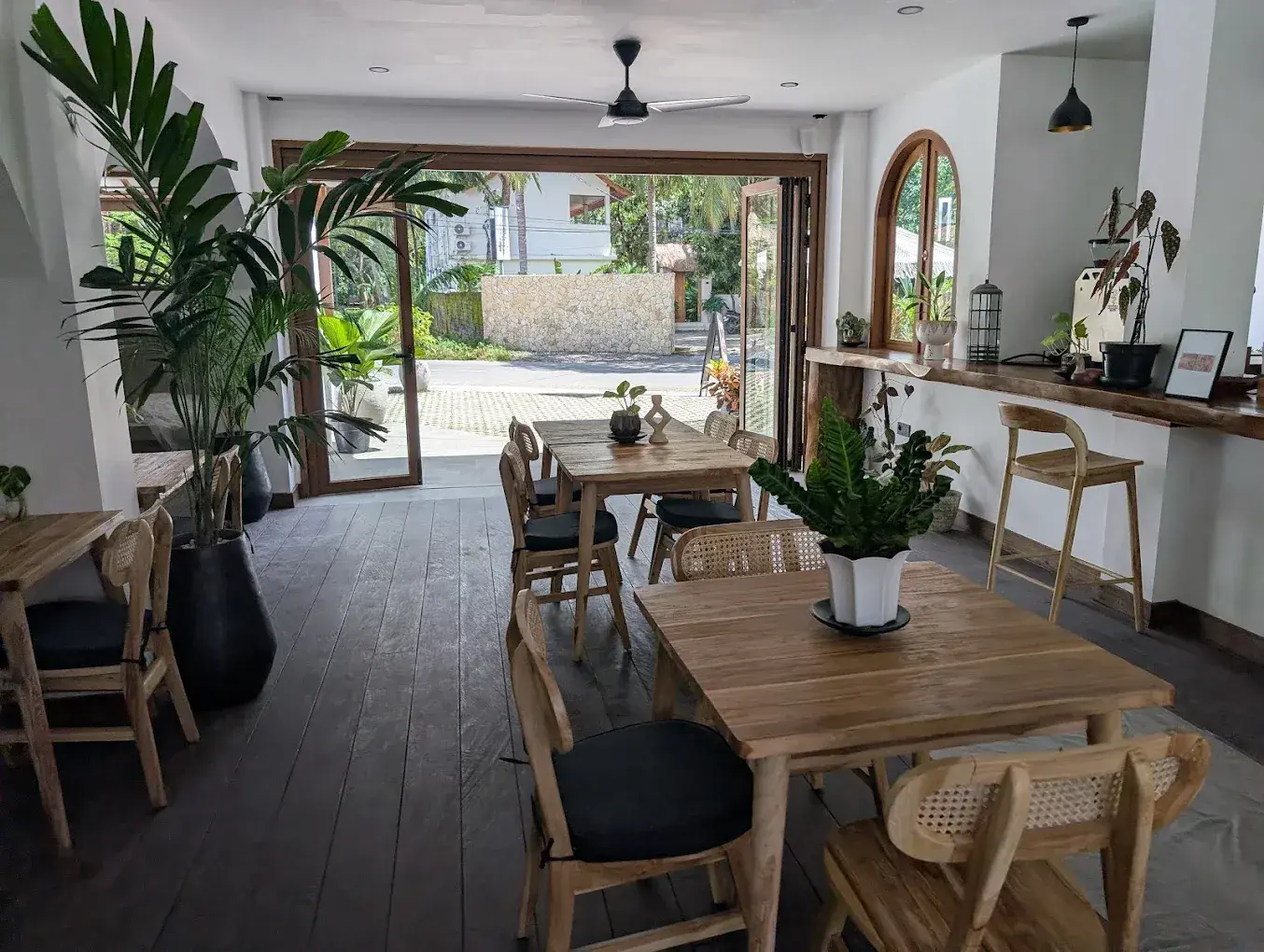 Bareng Coffee Bar interior with timber tables and open frontage, Selong Belanak, Lombok